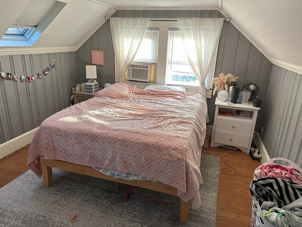 129 Conant Street Danvers, MA 01923 - Photo 8 of 14 a bedroom with a bed toilet and window