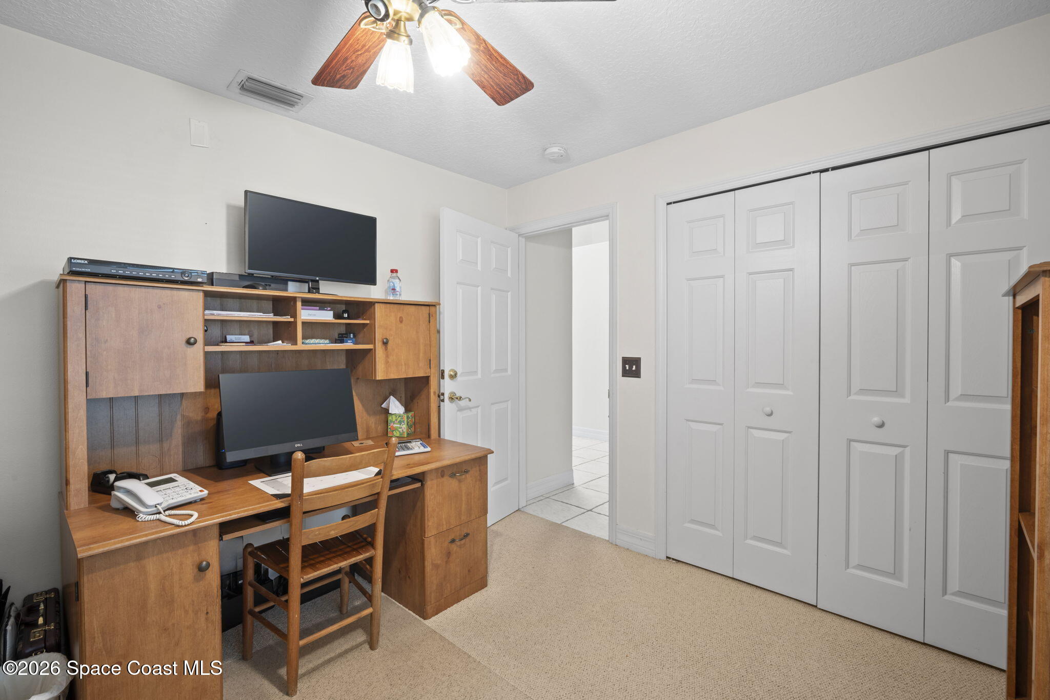 3125 Davis Road Mims, FL 32754 - Photo 8 of 47 a view of a livingroom with furniture and a flat screen tv