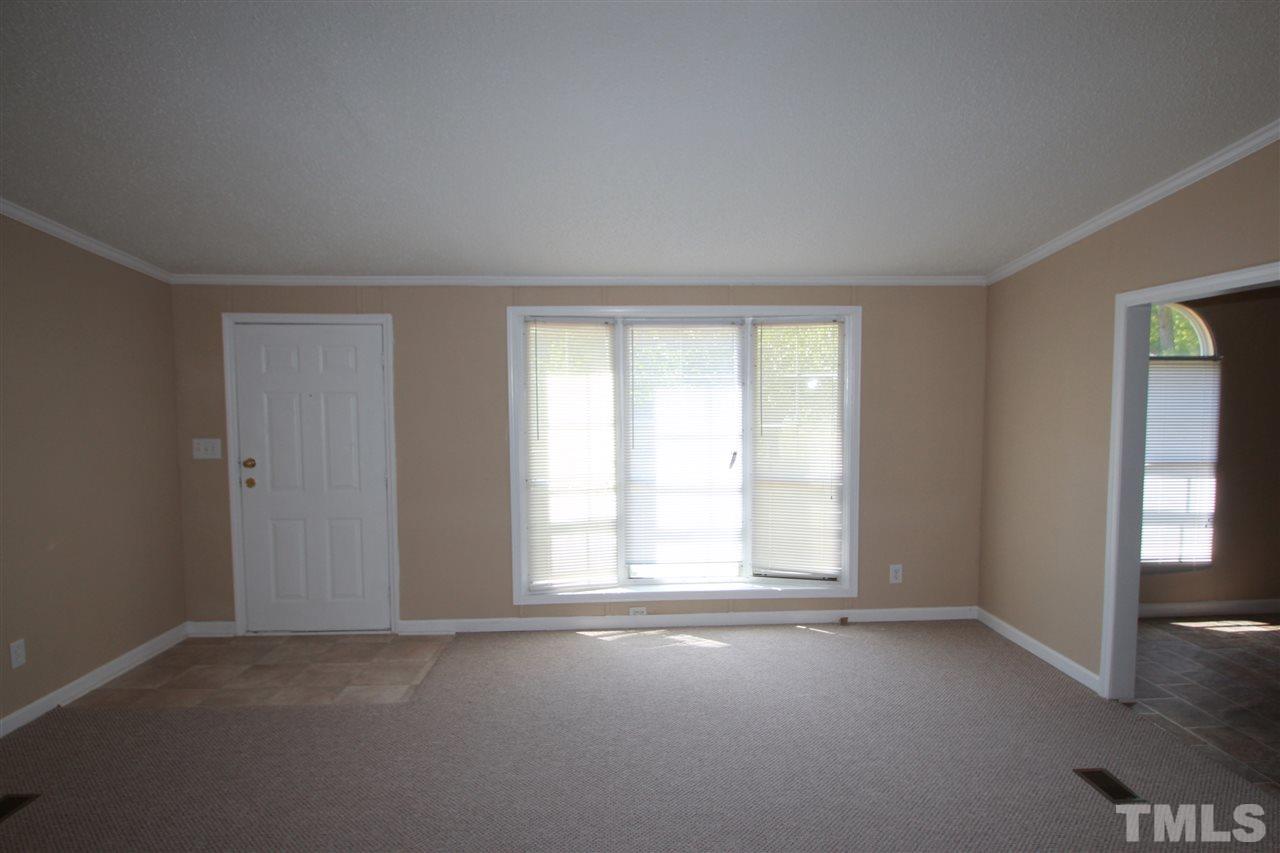 407 Line Road Cameron, NC 28326 - Photo 2 of 13 an empty room with windows