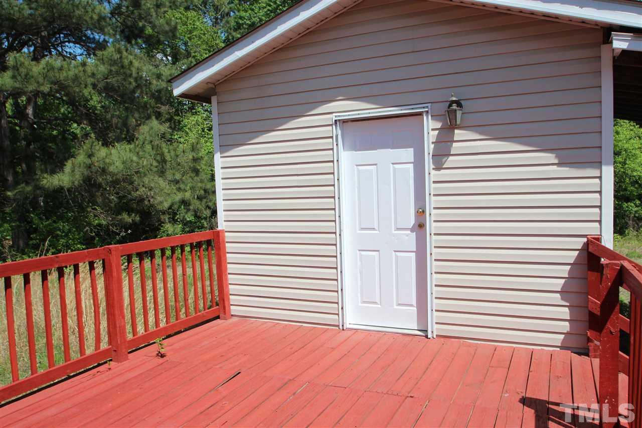 407 Line Road Cameron, NC 28326 - Photo 9 of 13 a view of a backyard with a deck and wooden floor