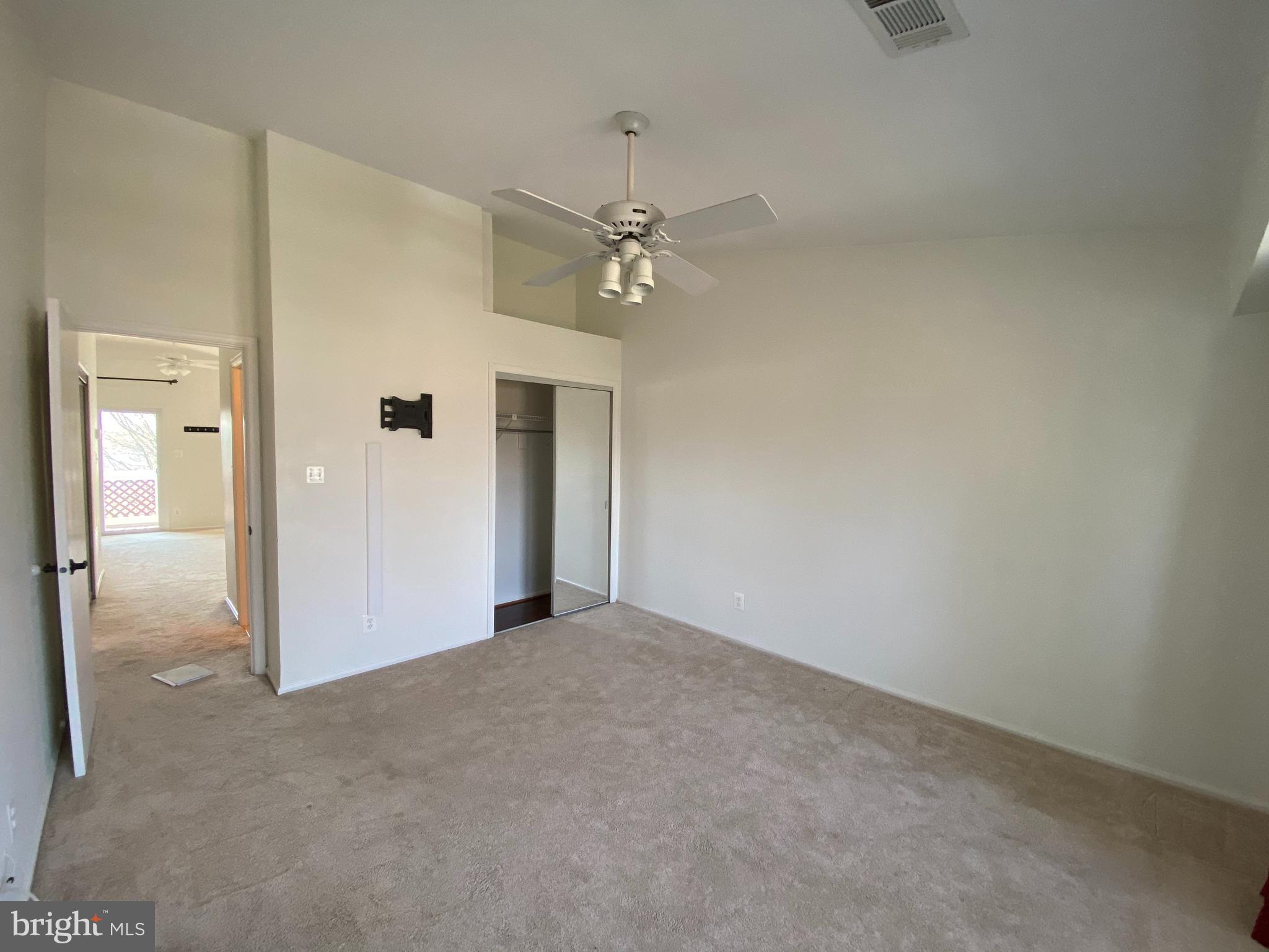 12944 Grays Pointe Road, Unit 12944C Fairfax, VA 22033 - Photo 13 of 16 an empty room with a ceiling fan and a window