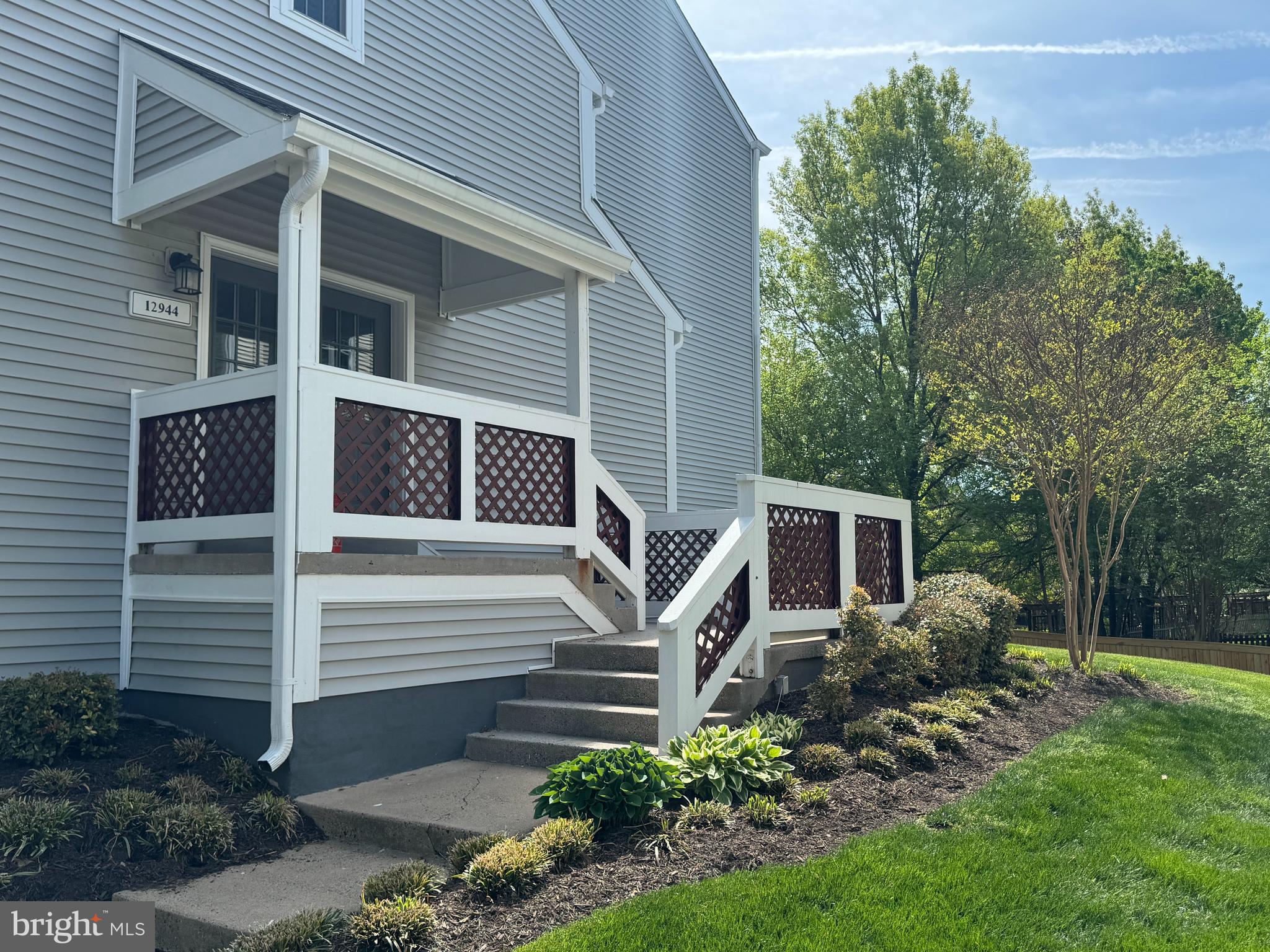 12944 Grays Pointe Road, Unit 12944C Fairfax, VA 22033 - Photo 2 of 16 a view of a house with backyard and garden