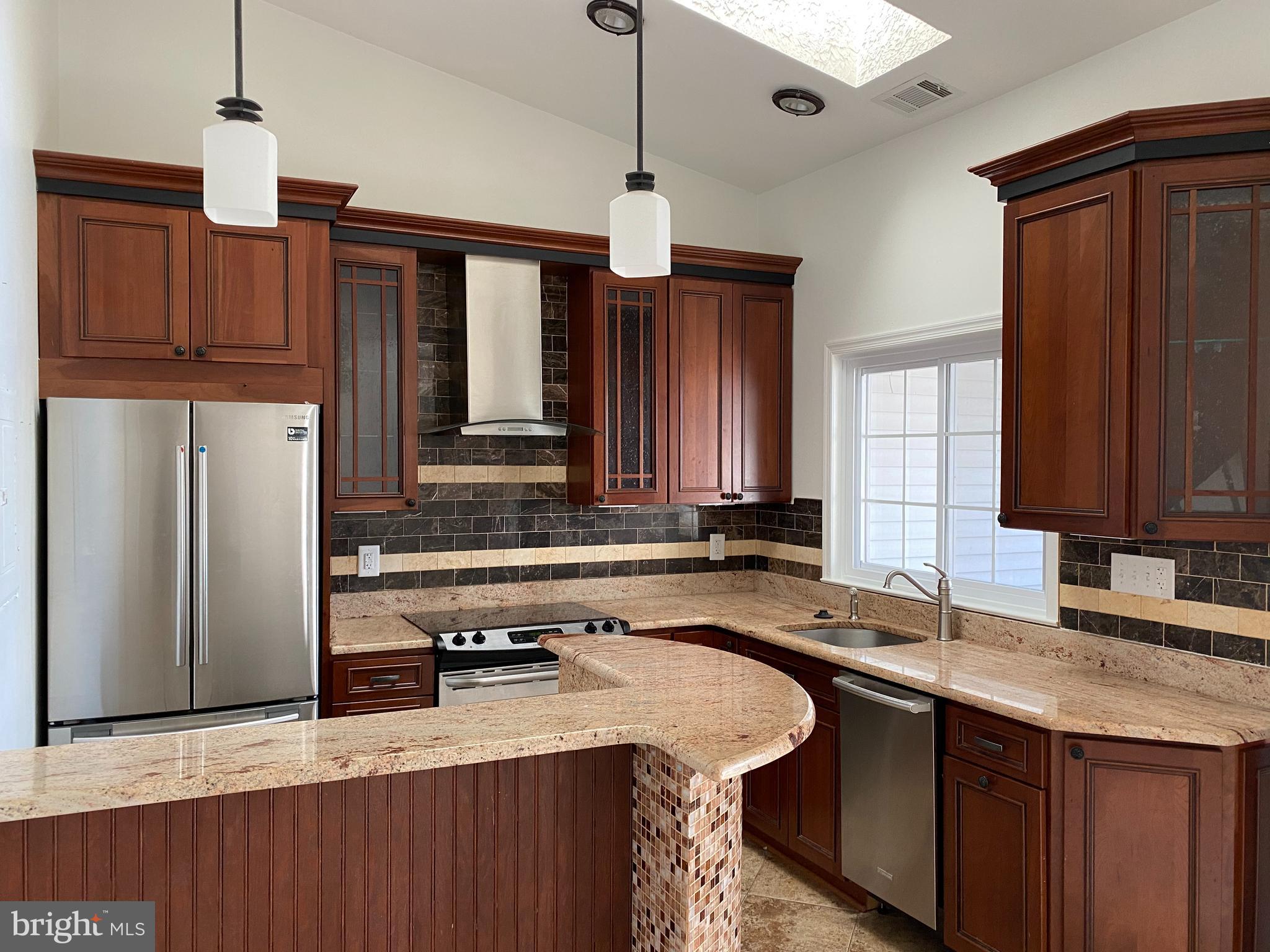 12944 Grays Pointe Road, Unit 12944C Fairfax, VA 22033 - Photo 6 of 16 a kitchen with granite countertop a sink a counter top space and cabinets