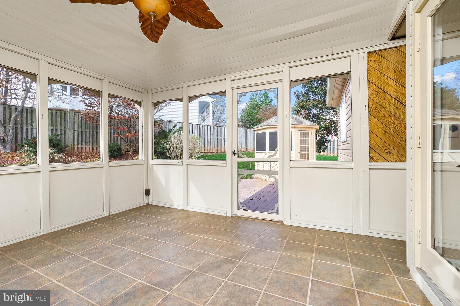 5819 Stone Ridge Drive Centreville, VA 20120 - Photo 6 of 24 Screened in porch leading to back garden patio.