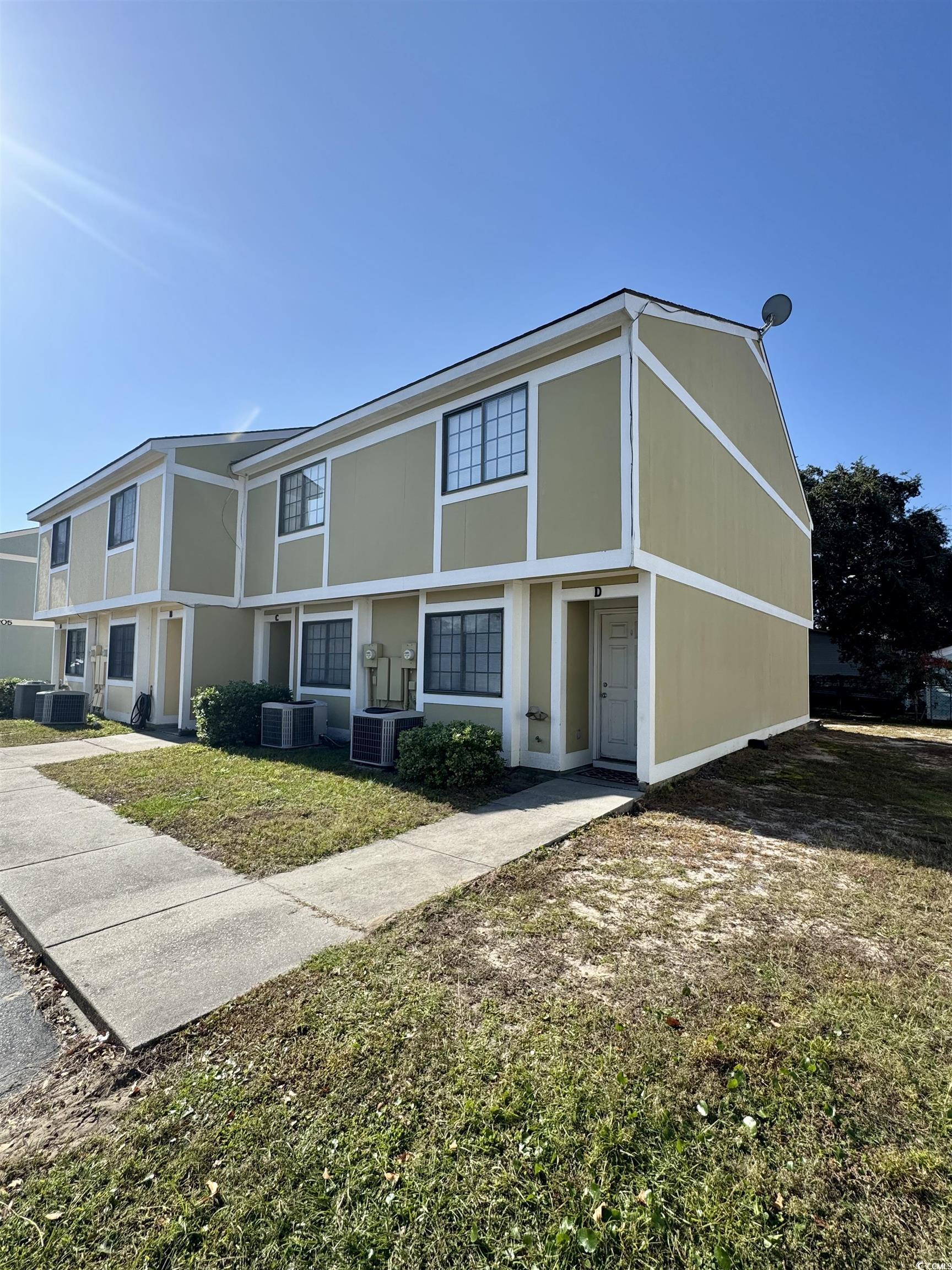 1207 Pinegrove Drive, Unit C Myrtle Beach, SC 29577 - Photo 13 of 16 Tudor-style house with a front lawn