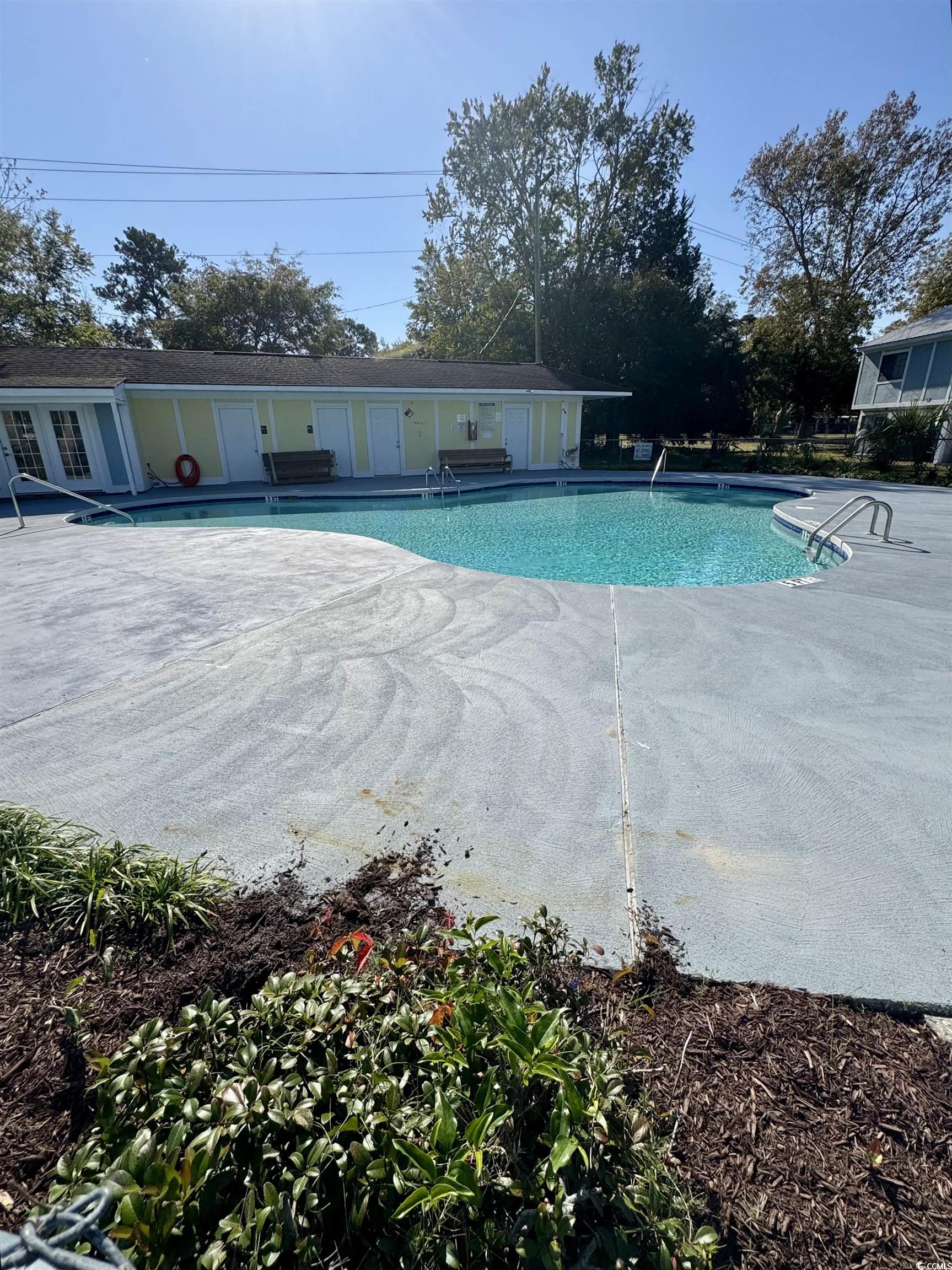 1207 Pinegrove Drive, Unit C Myrtle Beach, SC 29577 - Photo 15 of 16 Community pool with a patio