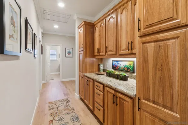 a kitchen with stainless steel appliances granite countertop a refrigerator and a stove