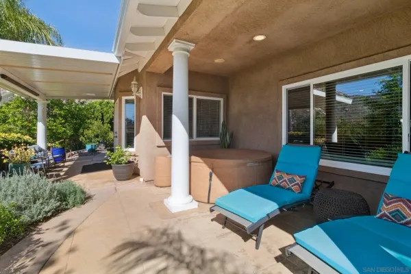 a outdoor living space with furniture and a potted plant