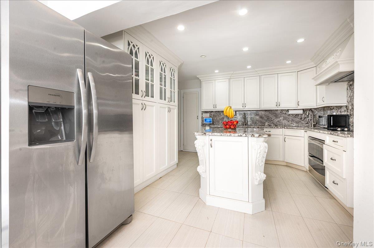 70 Longfellow Road Great Neck, NY 11023 - Photo 9 of 28 a kitchen with cabinets and stainless steel appliances