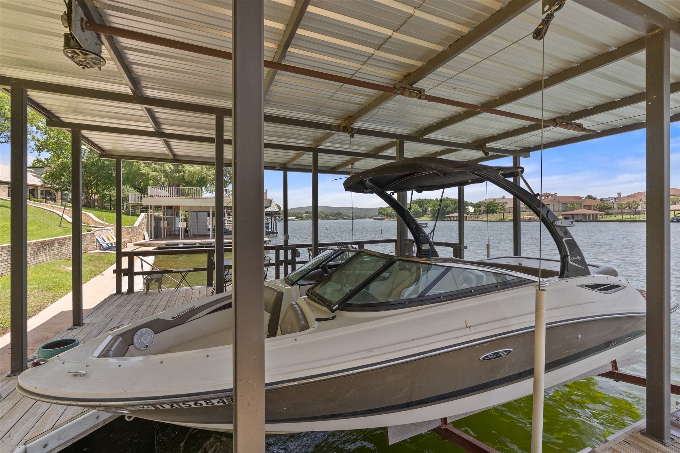141 Perry Lane Kingsland, TX 78639 - Photo 9 of 40 A private boat dock with covered slip offers direct lake access and panoramic water views.