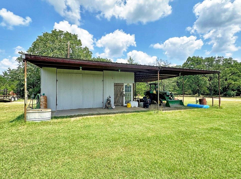 10466 Fm 3273 Athens, TX 75751 - Photo 14 of 24 a view of a backyard with sitting area and garden