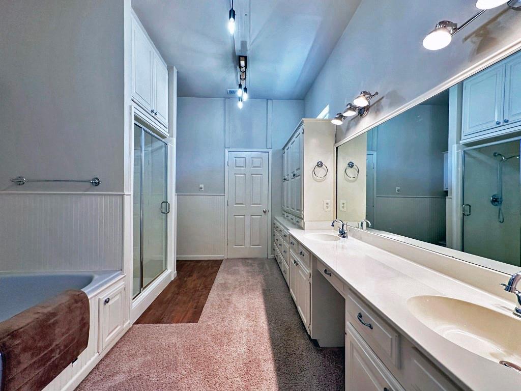 10466 Fm 3273 Athens, TX 75751 - Photo 6 of 24 a spacious bathroom with a double vanity sink a large mirror and shower