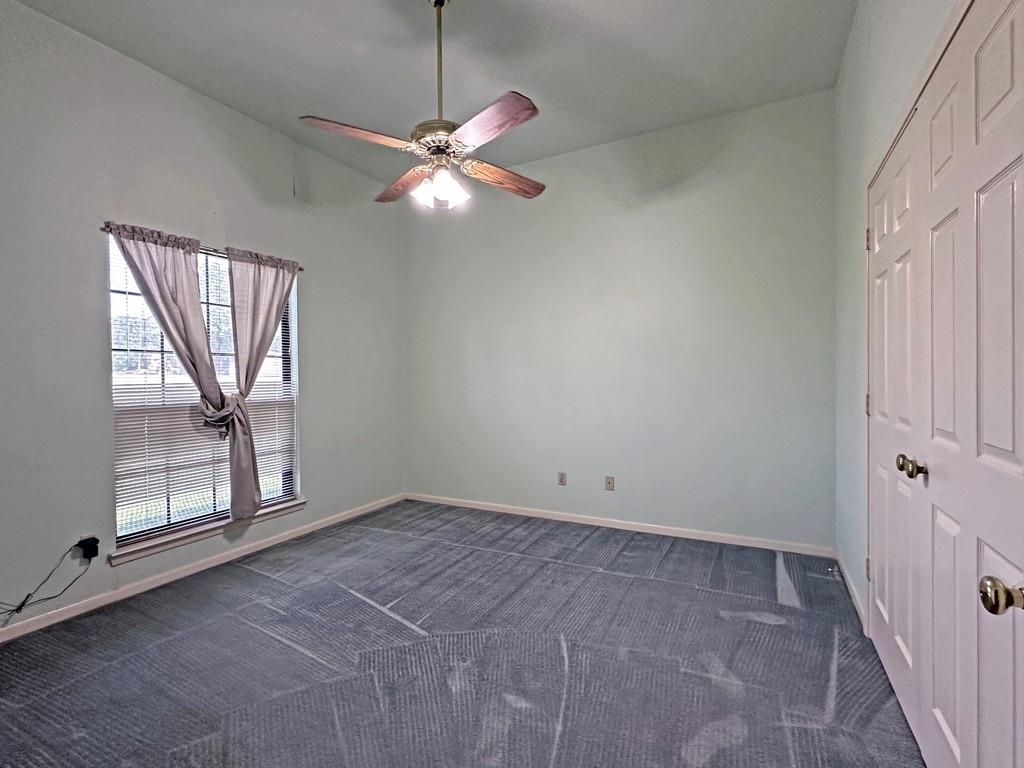 10466 Fm 3273 Athens, TX 75751 - Photo 8 of 24 an empty room with windows and fan