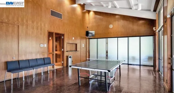 a dining room with furniture and wooden floor