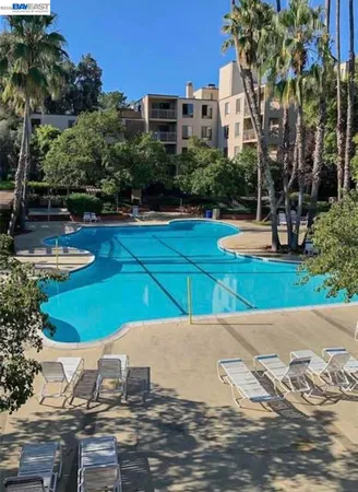 a view of a swimming pool with a patio