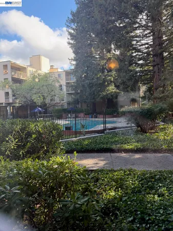 a small pool is sitting in the middle of a lake