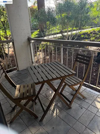 a view of a chairs and table on the terrace