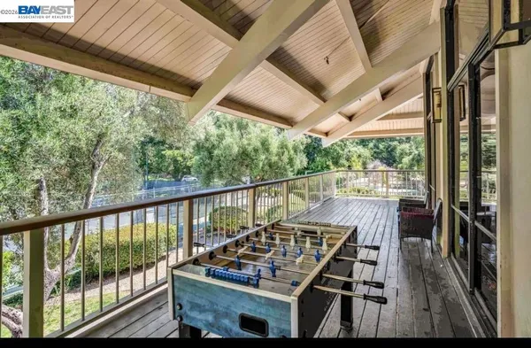 a view of balcony with furniture and wooden deck