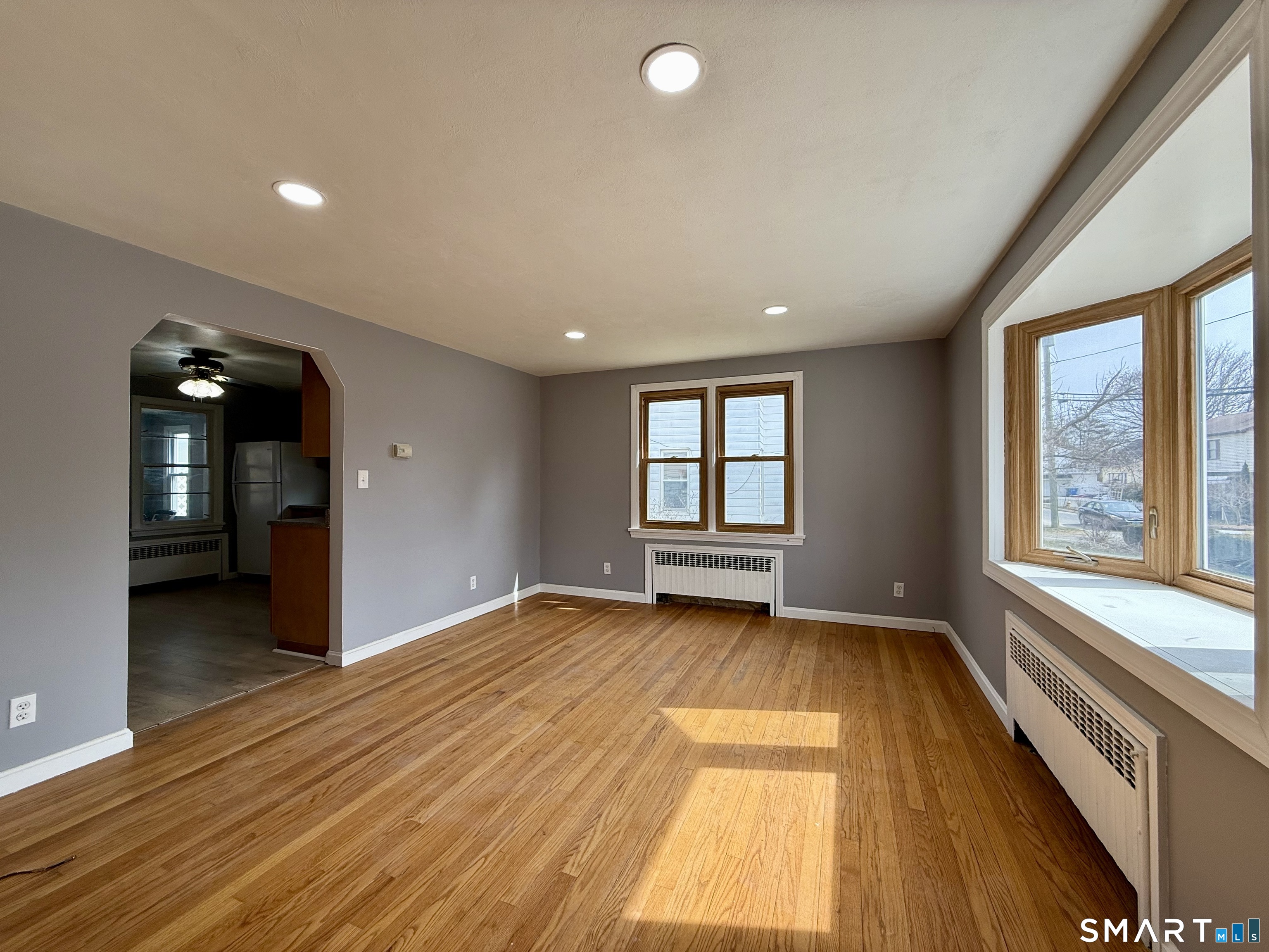 37 Alexander Avenue, Unit 1 Waterbury, CT 06705 - Photo 1 of 14 wooden floor in an empty room with a window