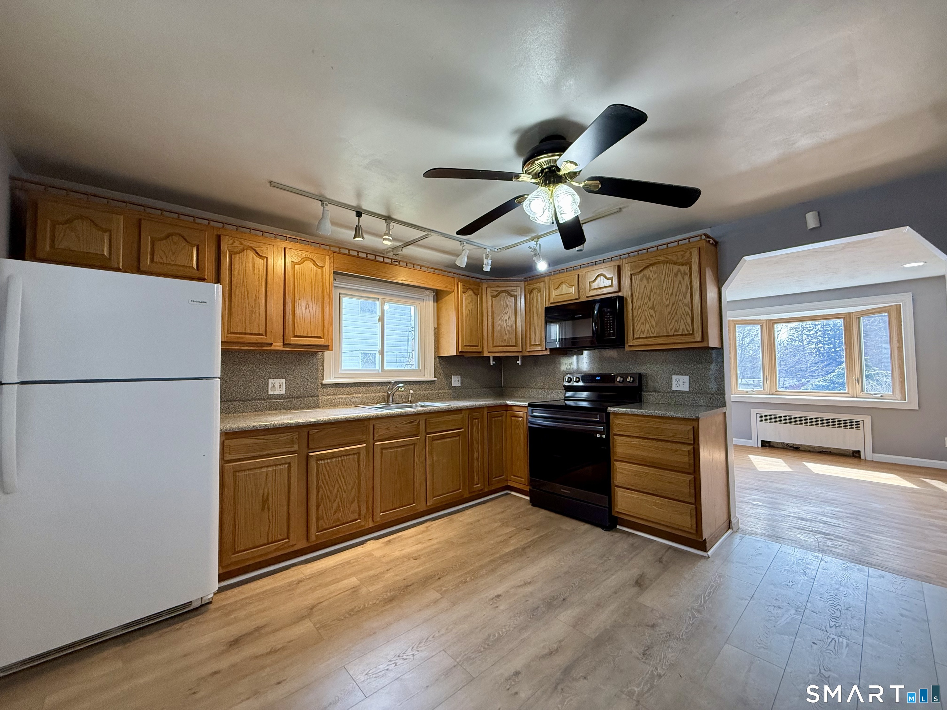 37 Alexander Avenue, Unit 1 Waterbury, CT 06705 - Photo 6 of 14 a kitchen with stainless steel appliances granite countertop a refrigerator a stove top oven a sink dishwasher and a refrigerator
