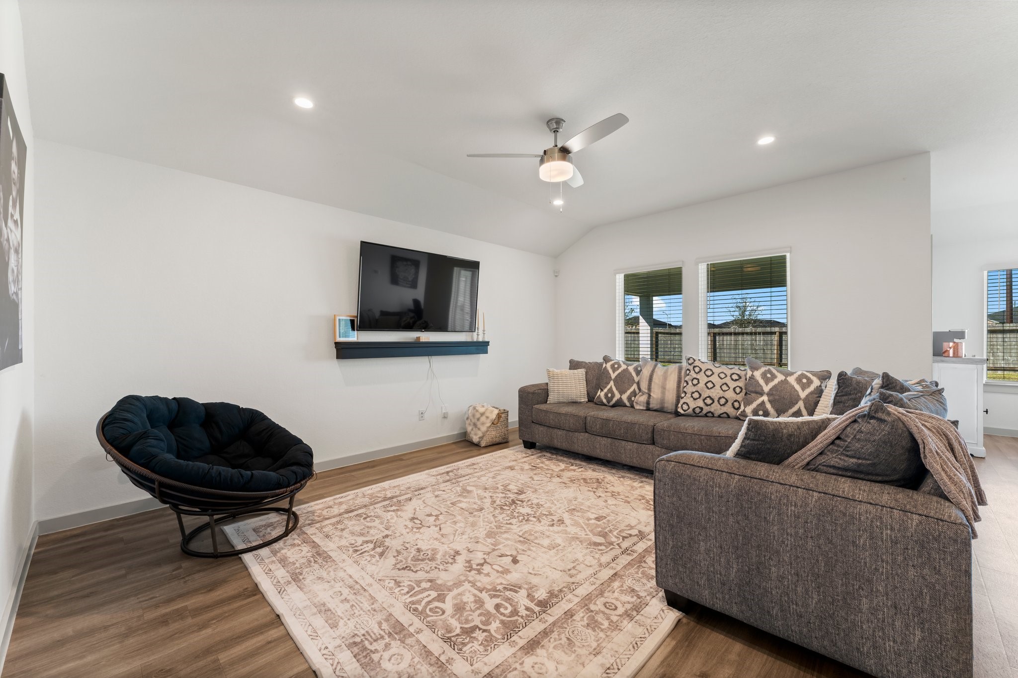 1007 Cotswold Court Rosharon, TX 77583 - Photo 9 of 30 a living room with furniture a rug and a flat screen tv
