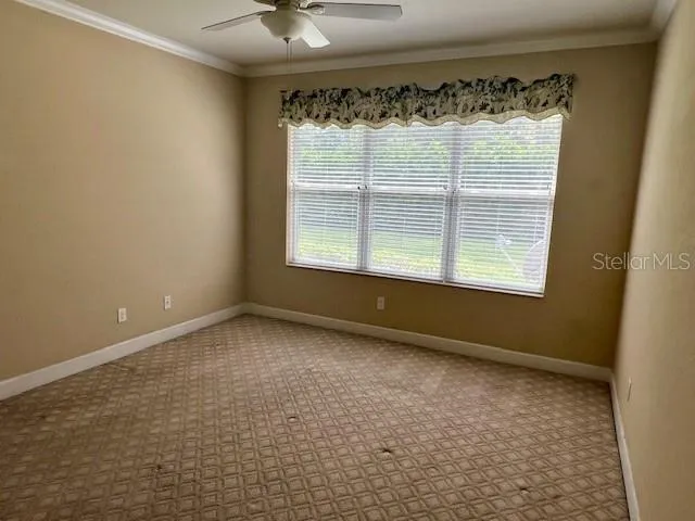 a view of an empty room and a window