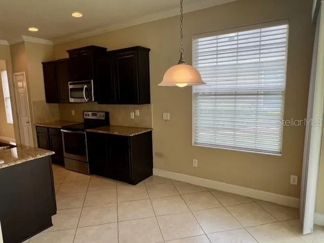 a kitchen with a sink and a microwave
