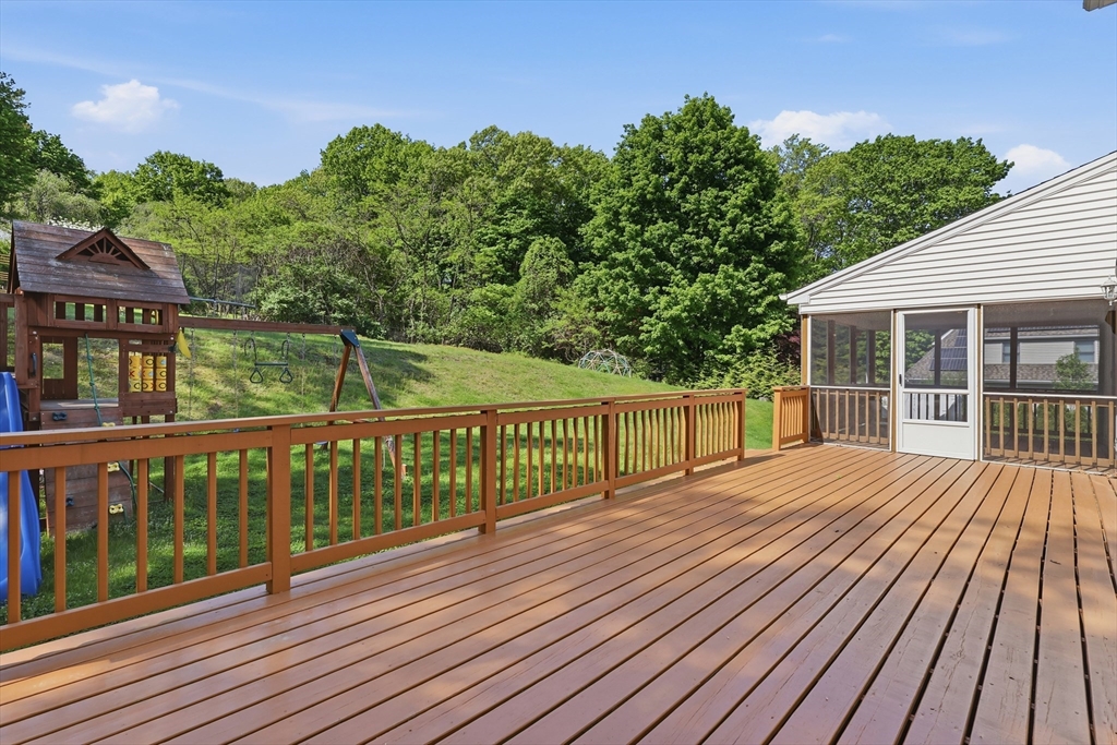 61 Indian Head Road Framingham, MA 01701 - Photo 36 of 42 a view of balcony with wooden floor and fence