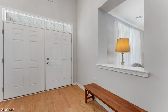 a bedroom with a bed and a mirror