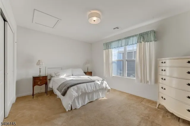 a bed room with a bed and a window