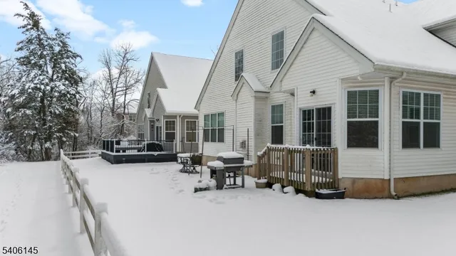 a view of a house with sitting area and roof deck
