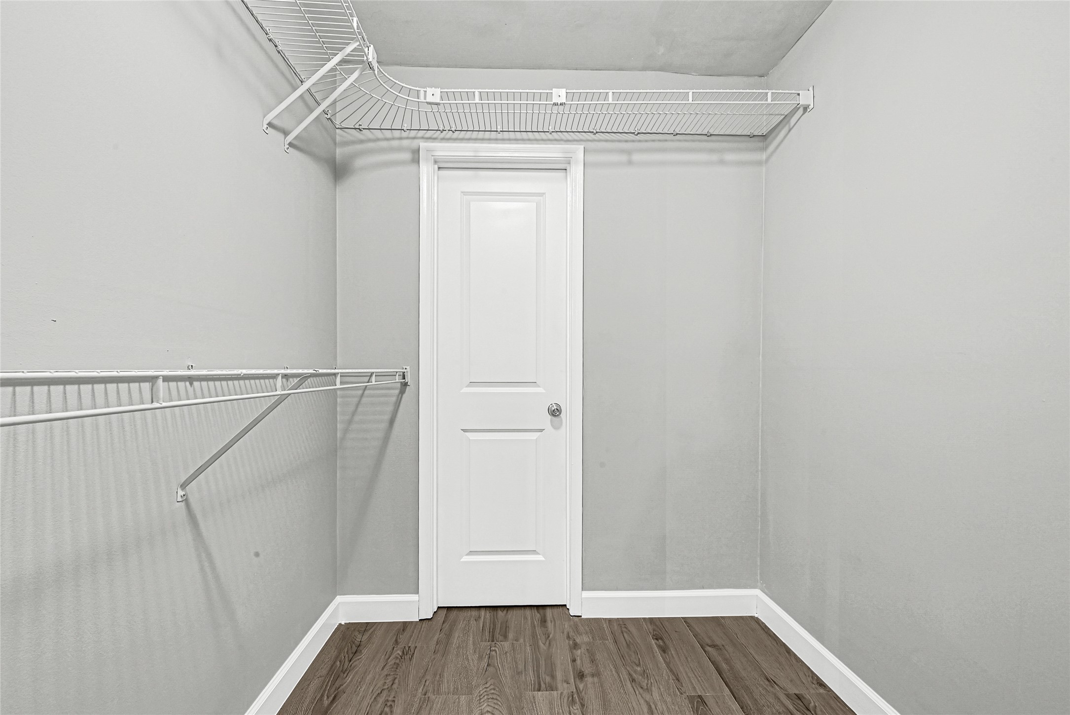 2407 Rambling Brook Drive Spring, TX 77373 - Photo 19 of 49 a view of walk in closet with wooden floor