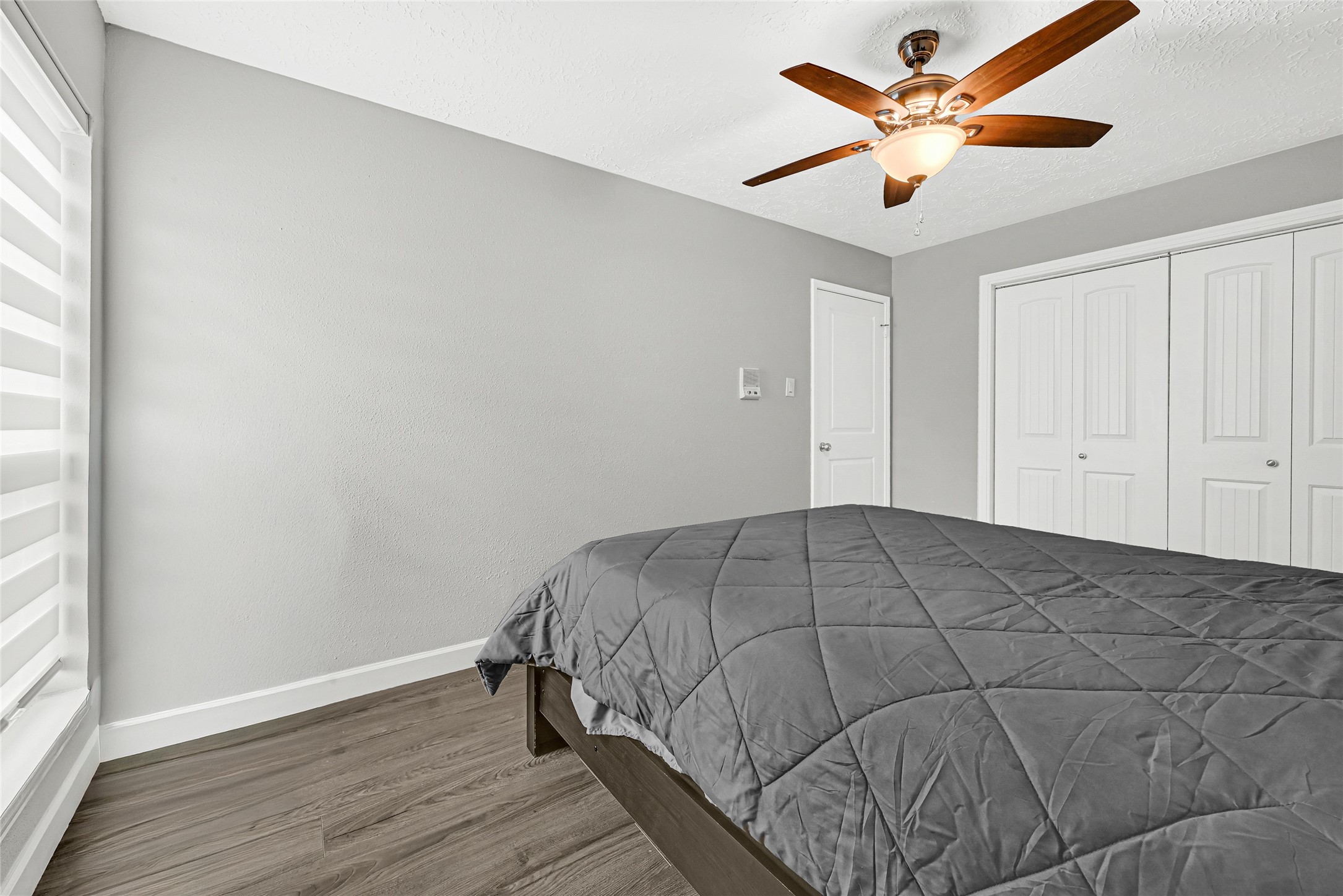 2407 Rambling Brook Drive Spring, TX 77373 - Photo 31 of 49 a bedroom with a bed and a chandelier