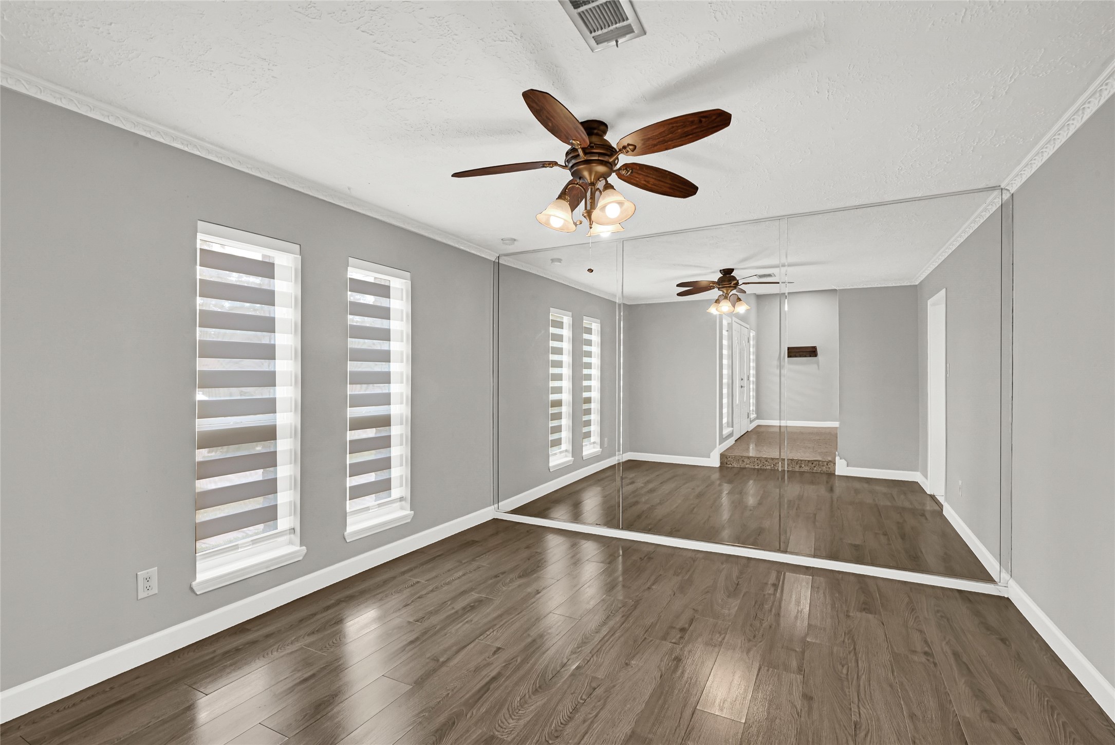 2407 Rambling Brook Drive Spring, TX 77373 - Photo 41 of 49 a view of a livingroom with wooden floor and a ceiling fan