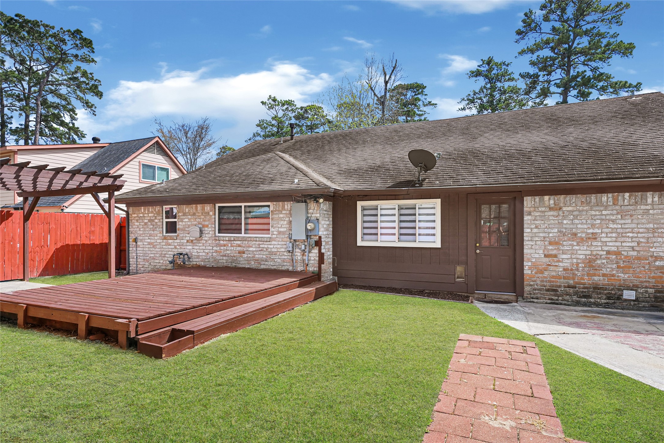 2407 Rambling Brook Drive Spring, TX 77373 - Photo 47 of 49 a front view of a house with garden