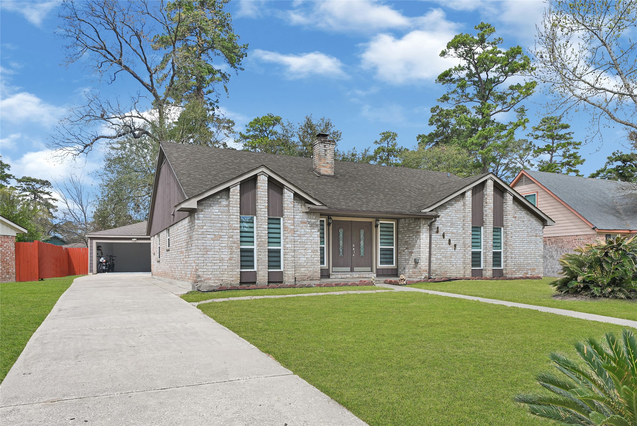 2407 Rambling Brook Drive Spring, TX 77373 - Photo 48 of 49 a front view of house with yard and green space