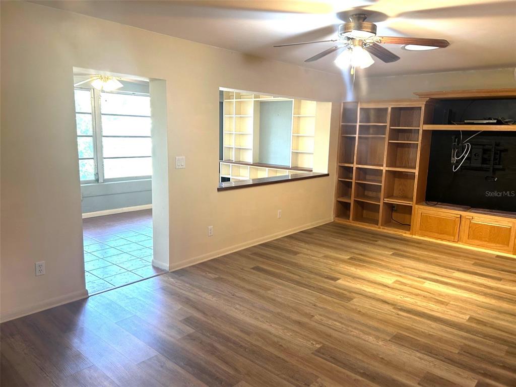 8655 Southwest 98th Street Road, Unit A Ocala, FL 34481 - Photo 13 of 24 Large Family room with custom built entertainment center