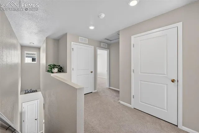 a view of a kitchen and an entryway