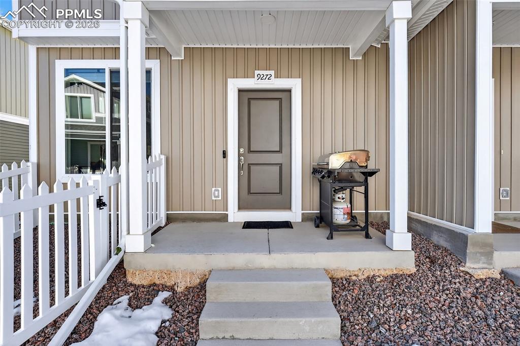 9272 Lytle Grove Colorado Springs, CO 80927 - Photo 4 of 40 a view of a porch with a table and chairs