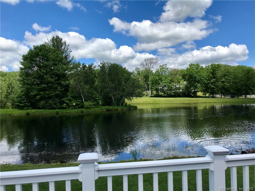 190 Blue Hills Road Durham, CT 06422 - Photo 1 of 1 a view of a lake in between two large trees