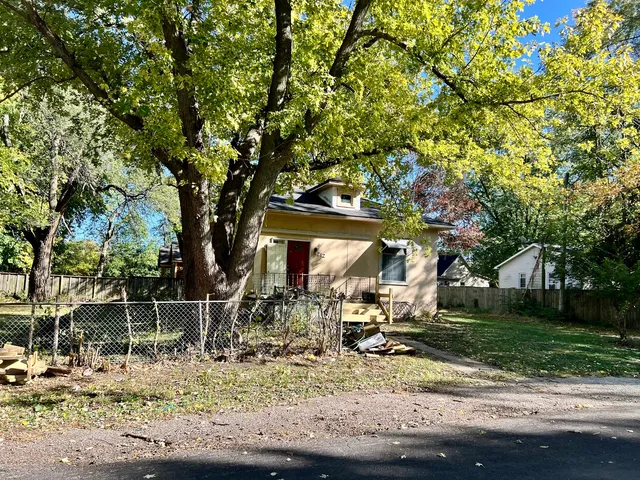 a view of a park with plants and trees