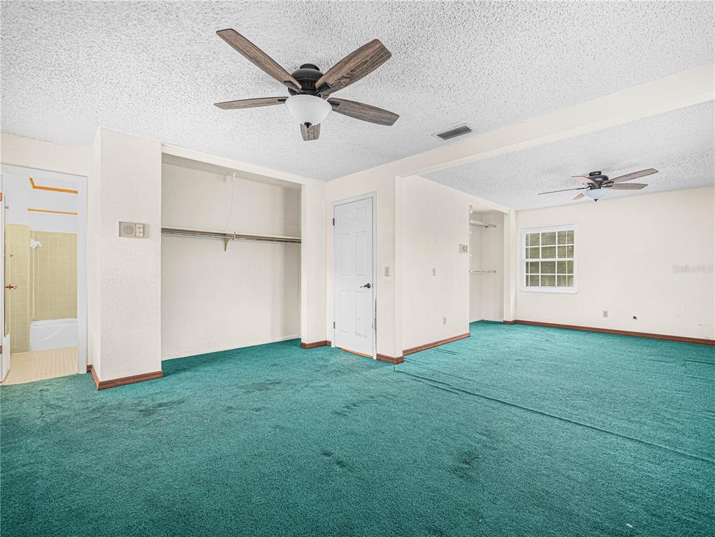 129 Lake Otis Road Winter Haven, FL 33884 - Photo 13 of 35 an empty room with closet and a ceiling fan