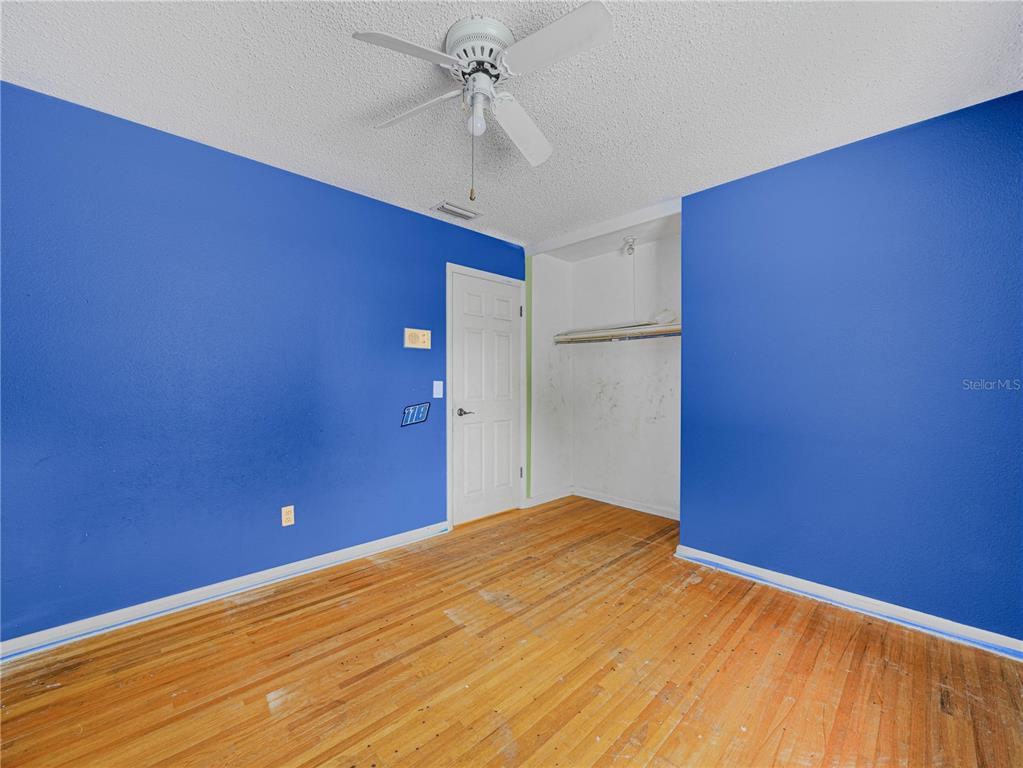 129 Lake Otis Road Winter Haven, FL 33884 - Photo 18 of 35 a view of a big room with closet and wooden floor