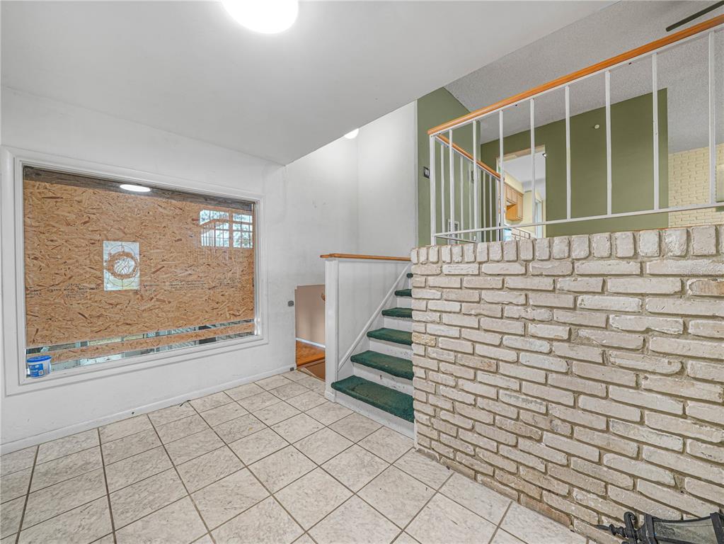 129 Lake Otis Road Winter Haven, FL 33884 - Photo 2 of 35 a view of an entryway with wooden floor