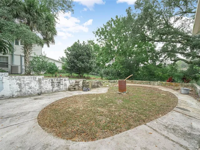 a view of a house with a yard and garage