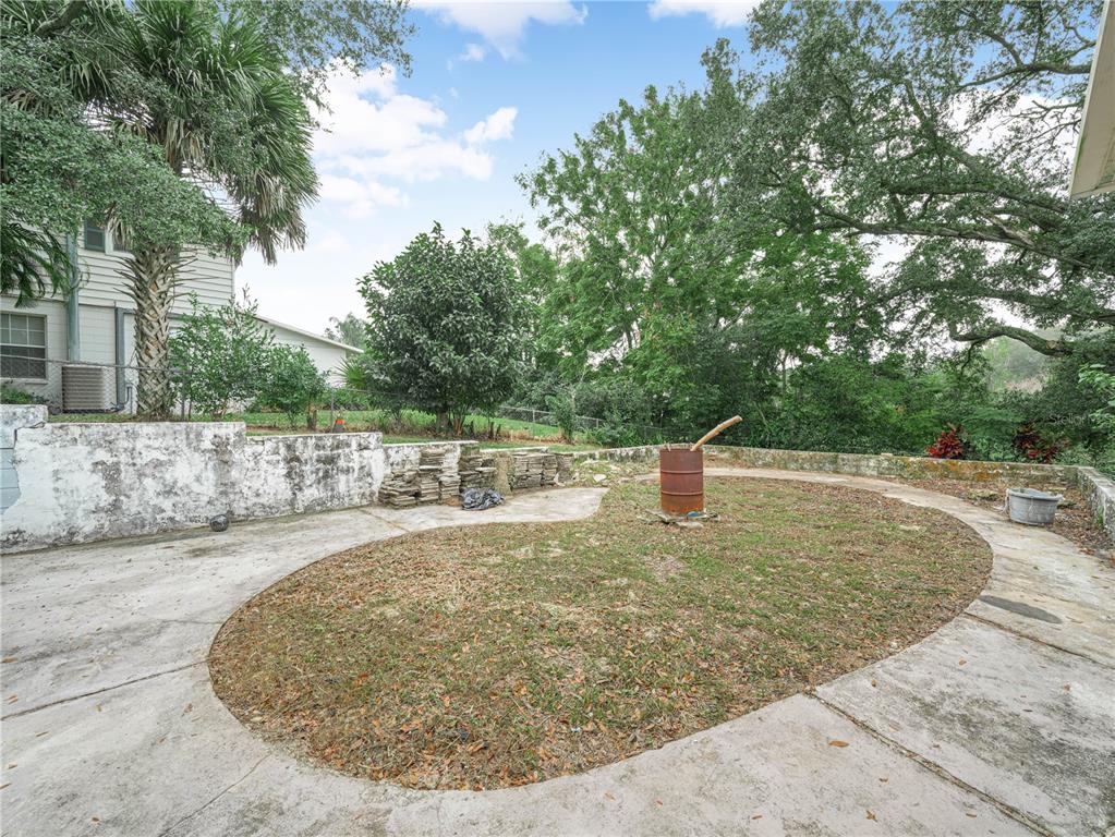 129 Lake Otis Road Winter Haven, FL 33884 - Photo 29 of 35 a view of a swimming pool with an outdoor space