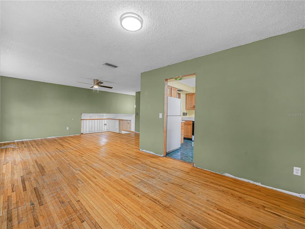 129 Lake Otis Road Winter Haven, FL 33884 - Photo 5 of 35 a view of empty room with wooden floor