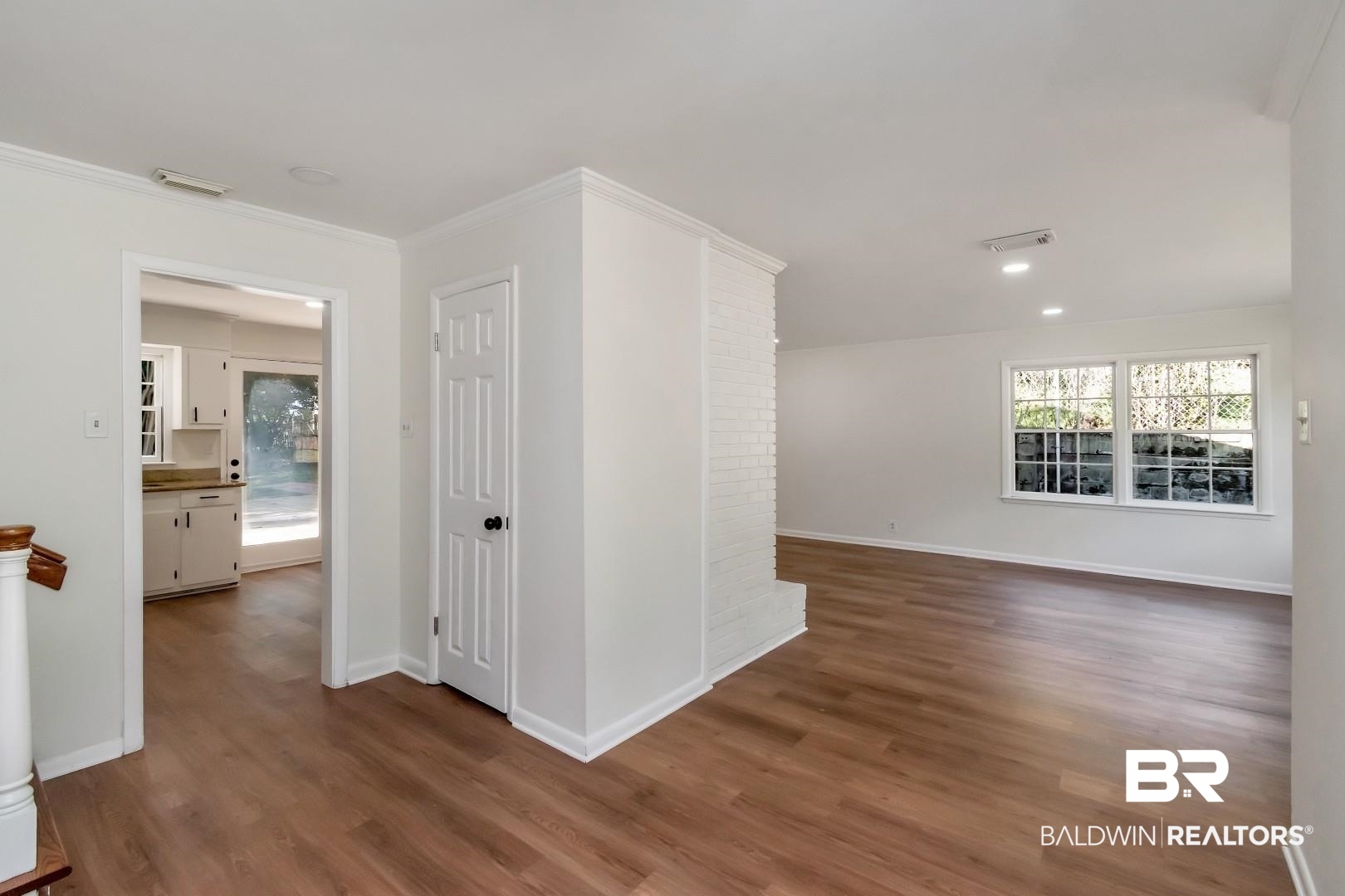 115 Pineridge Road Daphne, AL 36526 - Photo 4 of 34 Spare room featuring visible vents, baseboards, and wood finished floors
