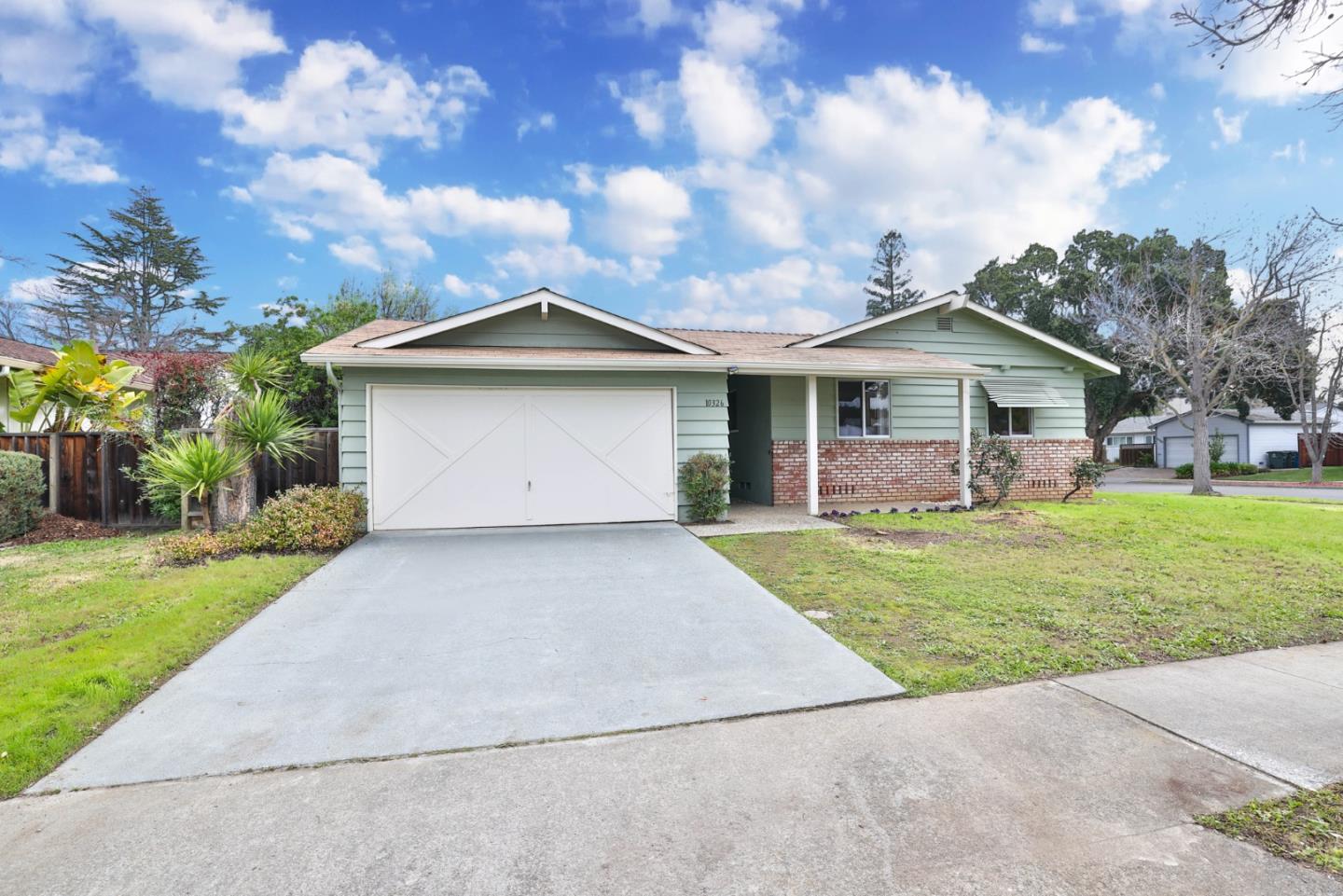 10326 Cherry Tree Lane Cupertino, CA 95014 - Photo 1 of 32 a front view of house with yard and green space