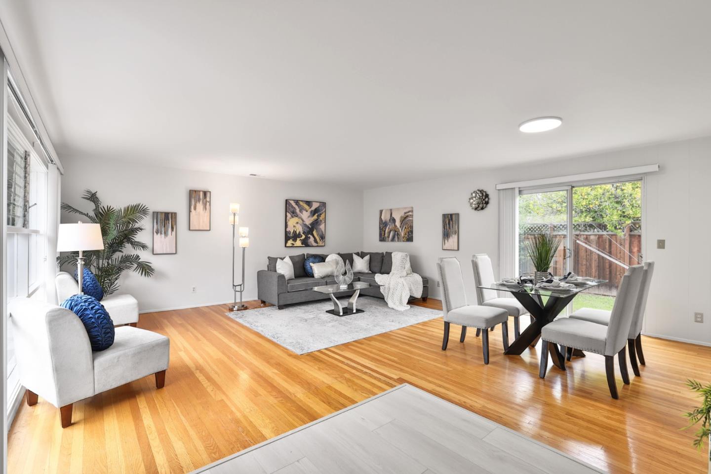 10326 Cherry Tree Lane Cupertino, CA 95014 - Photo 11 of 32 a living room with furniture and wooden floor
